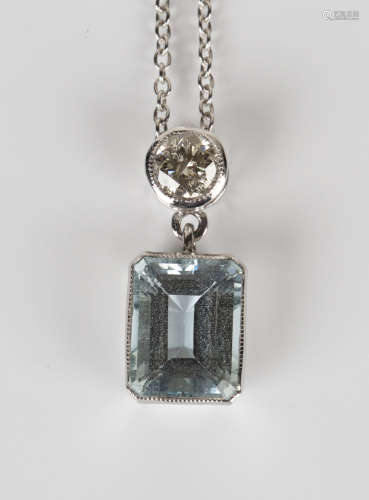 An 18ct white gold, aquamarine and diamond pendant, mounted with a rectangular cut aquamarine with a