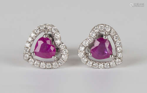 A pair of white gold, ruby and diamond heart shaped earstuds, each claw set with a heart shaped ruby