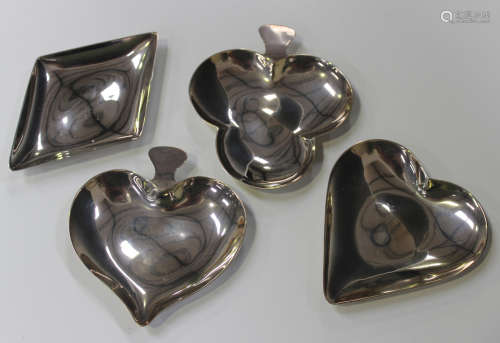 A set of four Elizabeth II silver bridge dishes, each in the form of a playing card suit, comprising