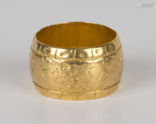 A 22ct gold wide band decorated wedding ring, Birmingham 1964, ring size approx N1/2.Buyer’s Premium