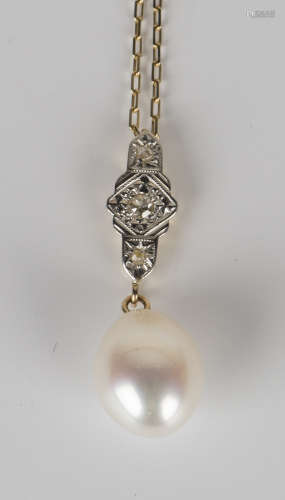 A gold, diamond and cultured pearl pendant, length 2.7cm, with a gold oval link neckchain, the