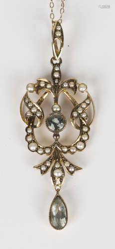 A gold, aquamarine and half-pearl set pendant in a scrolling design, detailed '9ct', length 5.5cm,