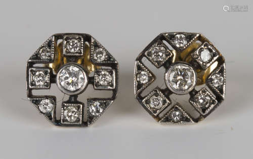 A pair of diamond cluster earstuds, each in a pierced octagonal design, mounted with the principal