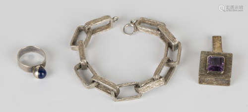 A small group of silver jewellery, comprising a rectangular link bracelet with a bark textured