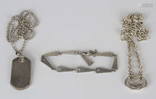 A small group of silver jewellery, comprising a Gucci necklace, a Tiffany & Co dog tag pendant