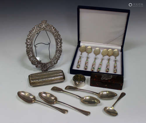 A group of silver items, comprising a Victorian rectangular three-section cigar case, an oval