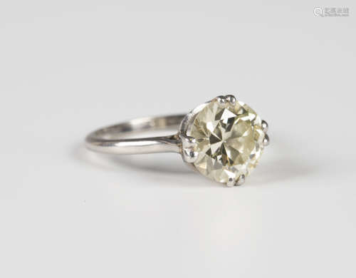 A platinum and diamond single stone ring, claw set with a circular cut diamond, detailed 'Plat',