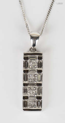An 18ct white gold and diamond rectangular pendant, mounted with baguette and circular cut diamonds,