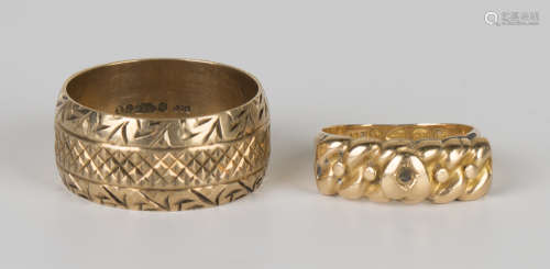 A 9ct gold wide band decorated wedding ring, London 1972, ring size approx S, and an 18ct gold ring,