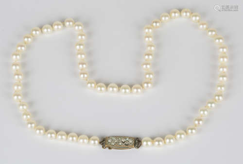 A single row necklace of uniform cultured pearls on a base metal clasp, length 49cm.Buyer’s