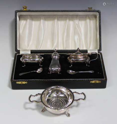 An Elizabeth II silver three-piece condiment set, comprising salt, pepper and mustard, with