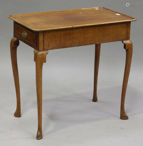 A George III Irish walnut silver table, the dished top above a drawer, on carved cabriole legs,