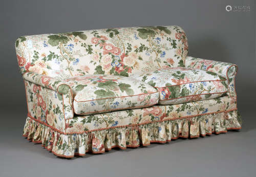 A mid/late 20th century Howard Chairs Ltd settee, the scroll back and arms upholstered in floral