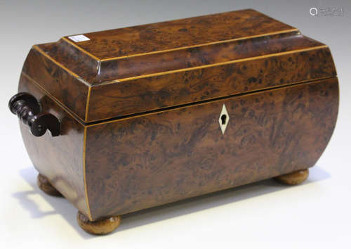 A Regency burr yew tea caddy of bombé sarcophagus form with boxwood stringing, the hinged lid