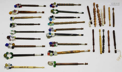 A collection of approximately thirty lace bobbins, including a small group of 19th century pewter