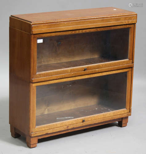 An Art Deco oak Globe Wernicke two-section glazed cabinet, on block legs, height 84cm, width 85cm,