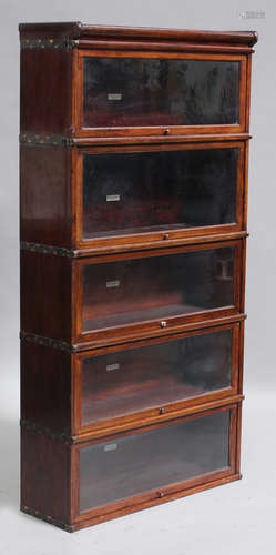 A set of twelve early 20th century mahogany Globe Wernicke glazed bookcase sections and three