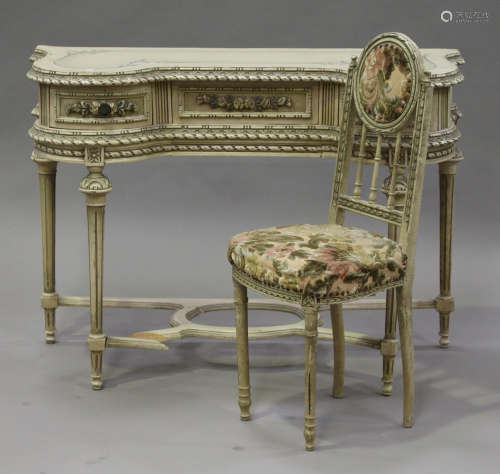 A 20th century French painted dressing table, the shaped top above three drawers, on turned and