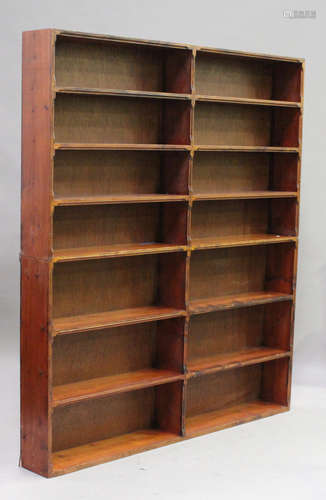 A 20th century stained pine six-tier open bookcase, with chamfered edges, height 200cm, width