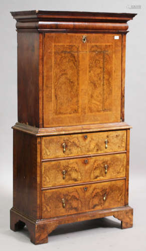 An early 18th century and later walnut éscritoire, the moulded top above a concealed drawer, the