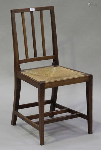 An Edward VII mahogany Coronation chair, the comb back above a rush seat, on square tapering legs