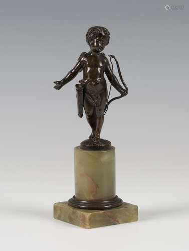 A late 19th/early 20th century Continental brown patinated cast bronze figure of Cupid holding a