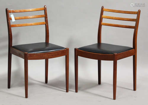 A set of eleven G-Plan teak framed dining chairs with black leatherette seats, height 84cm, width