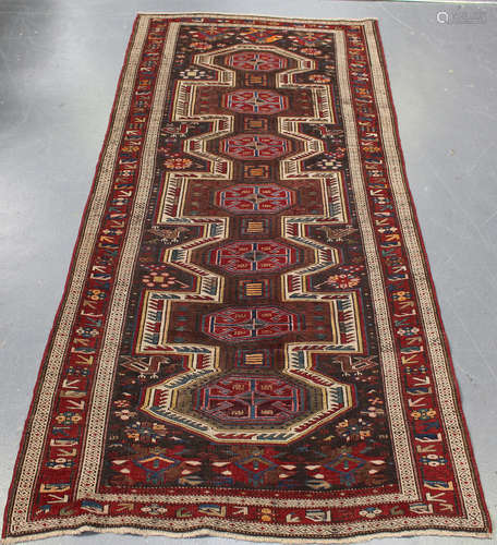 A Shirvan rug, South-east Caucasus, early 20th century, the charcoal field with an elongated