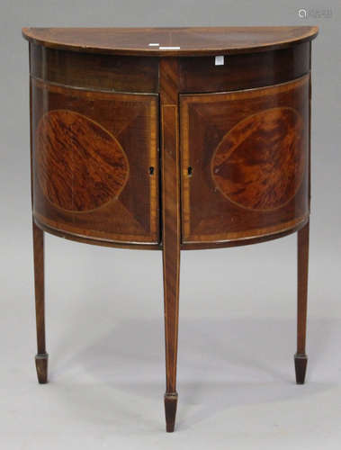 A George III mahogany and satinwood inlaid demi-lune side cabinet, fitted with a cupboard, on square