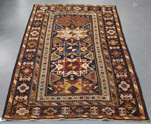 A Lesghi rug, North-east Caucasus, early 20th century, the midnight blue field with four and a