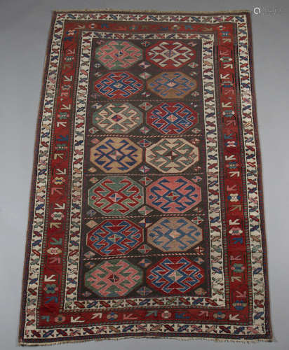 A Kazak Mogan rug, West Caucasus, early 20th century, the charcoal field enclosing two columns of