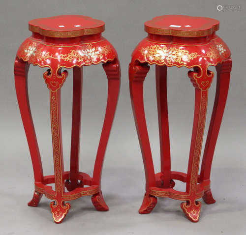 A pair of modern chinoiserie red painted stands with gilt and painted scrolls, raised on shaped