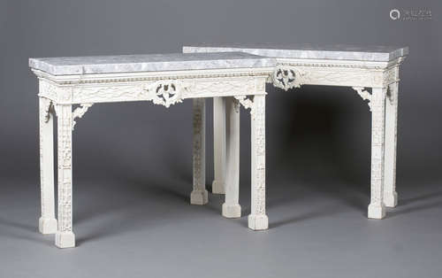 A pair of modern George III style white painted marble-topped hall tables, the shaped tops above