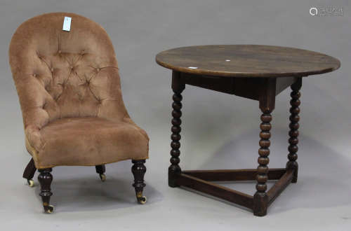 A 19th century oak circular table on bobbin turned legs, height 69cm, diameter 86cm (alterations),