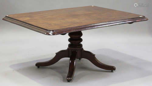 A Victorian mahogany rectangular single pedestal tip-top dining table, on a turned column and four