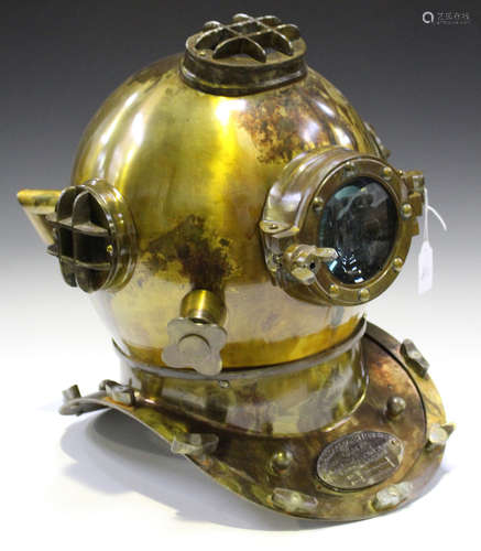 A late 20th century reproduction brass model of a U.S. Navy diving helmet, height 44cm.Buyer’s