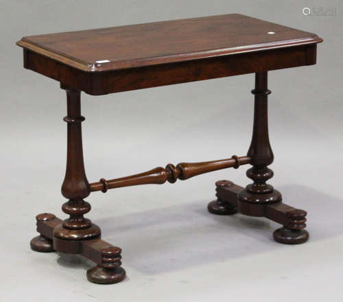 A mid-Victorian mahogany centre table, the moulded rectangular top raised on a pair of baluster