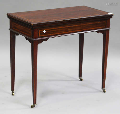 An Edwardian mahogany and satinwood crossbanded fold-over card table, raised on square tapering legs