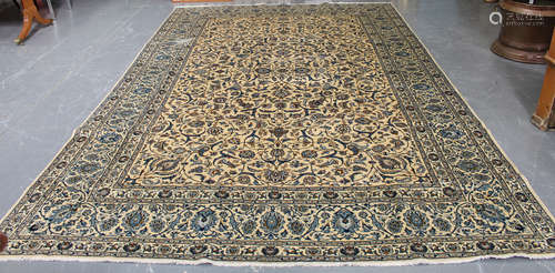 A Kashan carpet, Central Persia, mid/late 20th century, the ivory field with overall scrolling