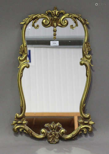 A 20th century French Rococo style cast gilt metal wall mirror with a foliate scroll frame, 64cm x