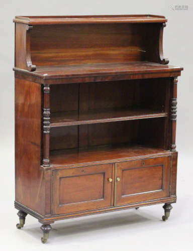 A William IV mahogany open bookcase, the gallery top above an open shelf, an adjustable shelf and