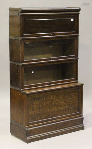 A George V oak four-section Globe Wernicke glazed bookcase, height 153cm, width 87cm, depth 122cm.