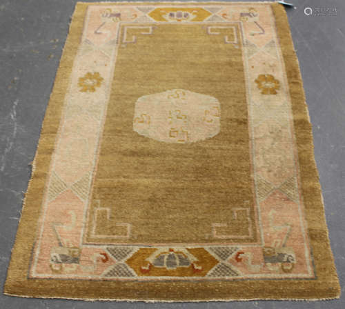 A Chinese rug, mid/late 20th century, the mustard yellow field with a central medallion, within a