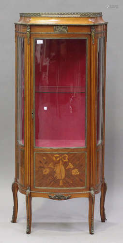 An early 20th century French kingwood and inlaid vitrine with gilt metal mounts, the glazed bowfront