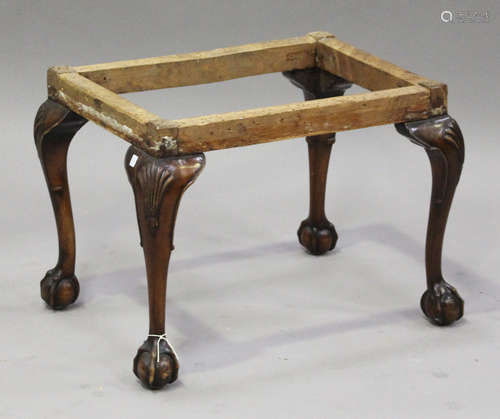 An early 20th century Queen Anne style walnut stool, the cabriole legs carved with shells,