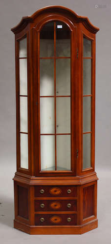 A late 20th century mahogany corner display cabinet, the lattice glazed top above drawers, on a