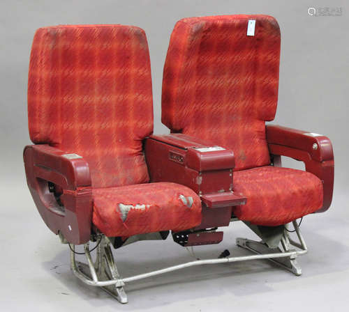 A mid/late 20th century Air France two-person aeroplane seat, finished in red, on cast metal base,