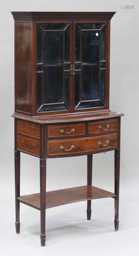 An Edwardian mahogany display cabinet by Cope & Collinson, the dentil moulded pediment above a