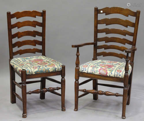 A set of eight late 20th century oak ladder back dining chairs with drop-in seats, comprising one