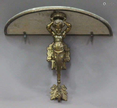 An early 20th century cast gilt brass demi-lune wall bracket console table, the marble top on a